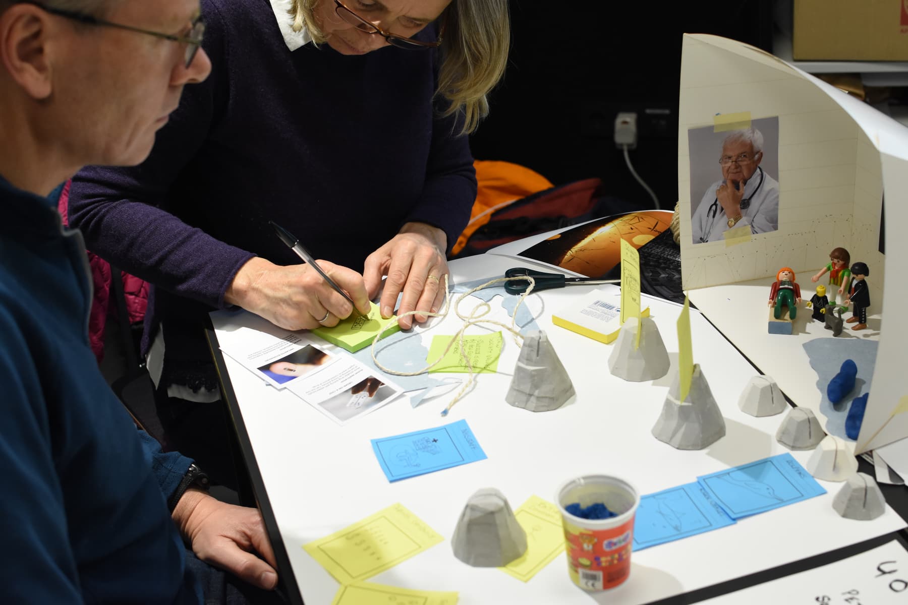 Participants build a diorama to represent their story.