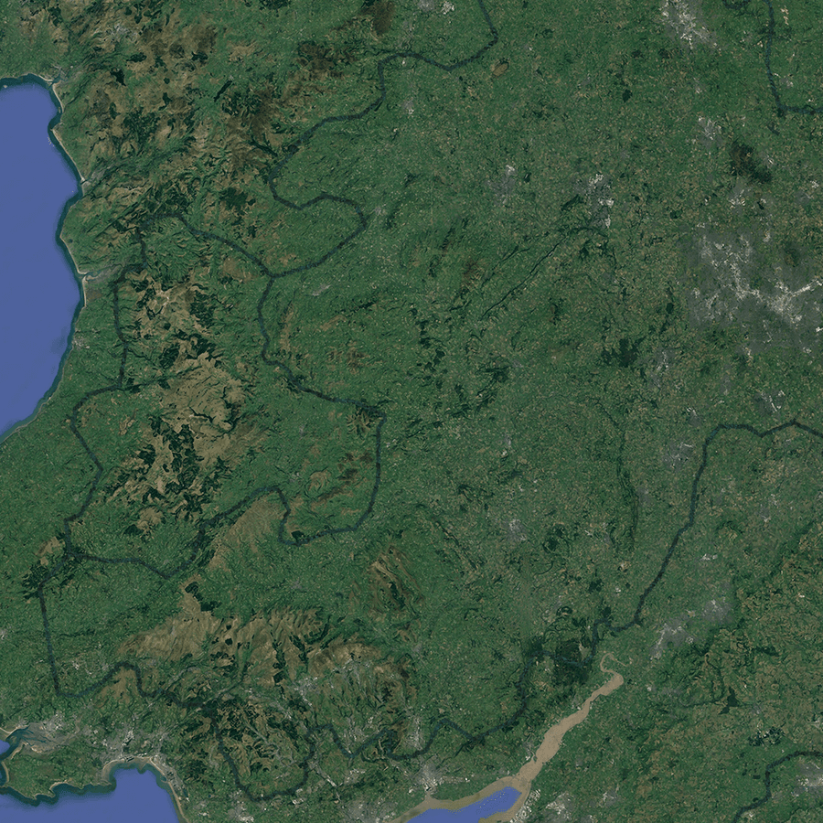 A satellite image of south Wales, with a linear forest snaking across the landscape.