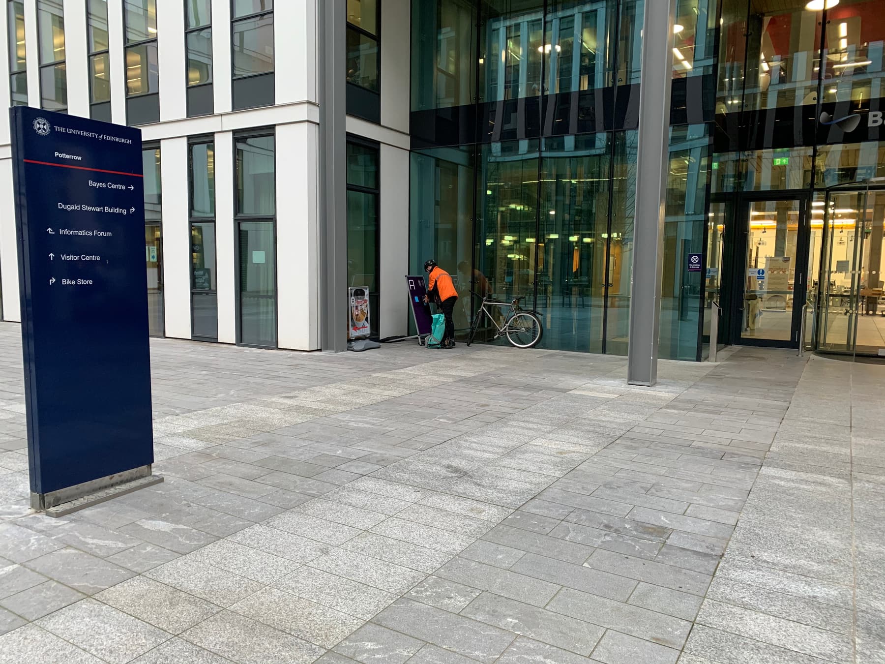 A bicyle makes a delivery to a hub.