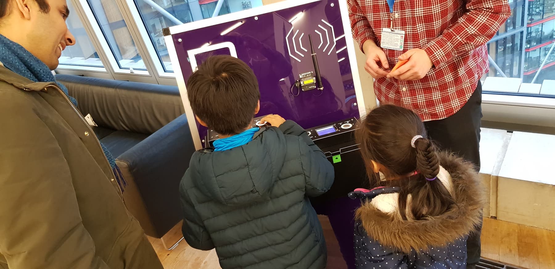 A family plays with an early version of GeoPact at the Tate Exchage event
'Living with the Internet of Things'.