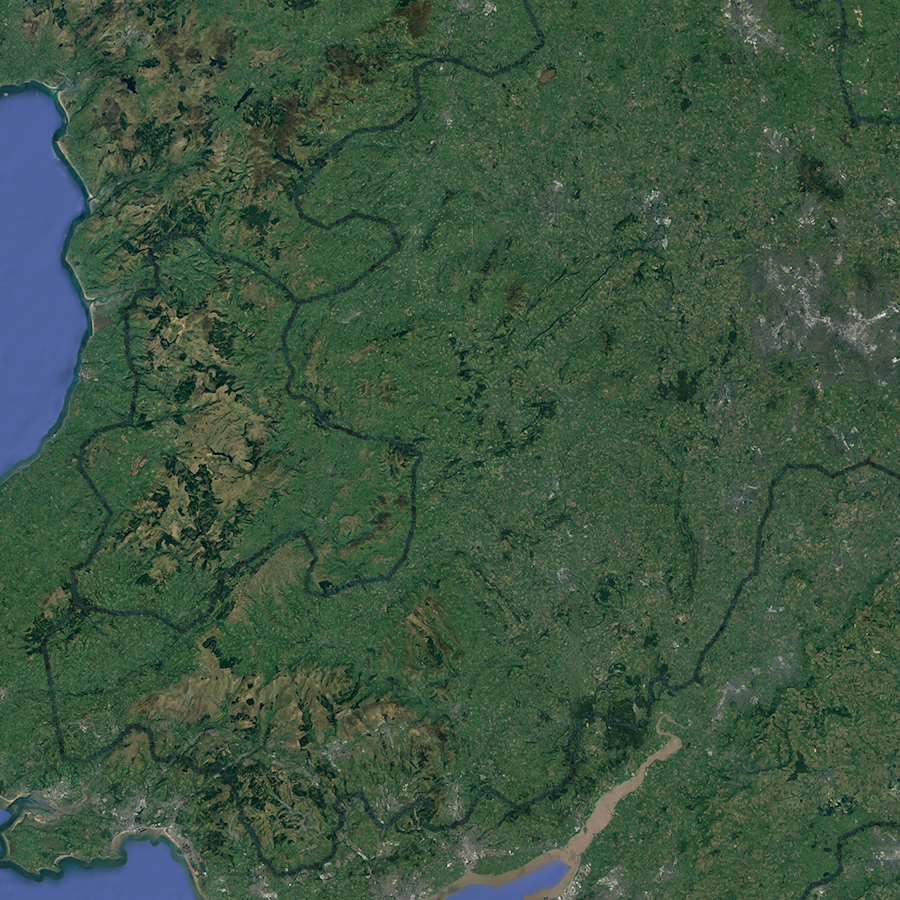 A satellite image of south Wales, with a linear forest snaking across the landscape.